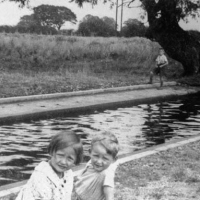 Raymond Johnson and cousin by the paddling pool